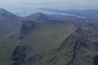 General oblique aerial view looking across Druim Finlach with Arisaig, Eigg and Rum beyond, taken from the SE.