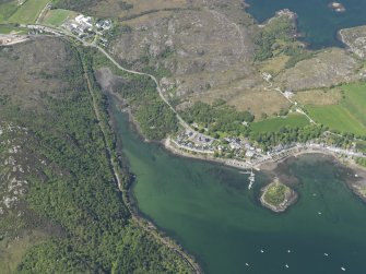 Oblique aerial view centred on Plockton village with the fish trap and kelp grid adjacent, taken from the ESE.