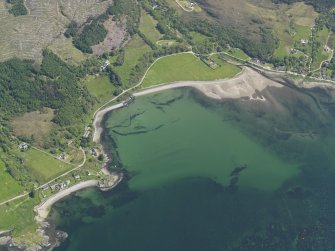 Oblique aerial view of Ardarroch and Ardoch centred on the fish traps in the bay, taken from the WNW.