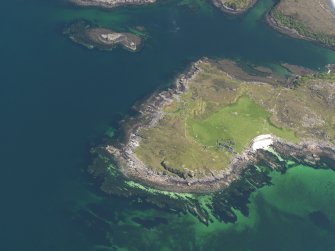 Oblique aerial view centred on the buildings and field banks at Ardban, taken from the WNW.