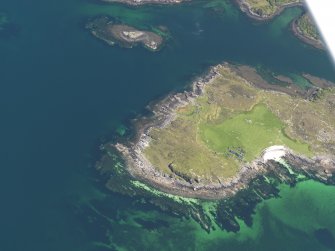 Oblique aerial view centred on the buildings and field banks at Ardban, taken from the WNW.