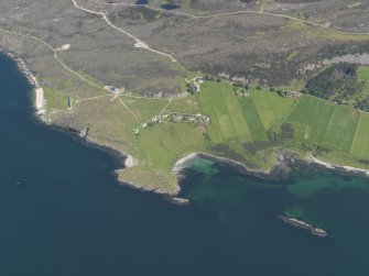 Oblique aerial view of Oskaig Point, the crofts and the possible fish trap, taken from the W.