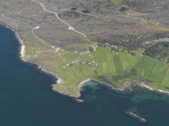 Oblique aerial view of Oskaig Point, the crofts and the possible fish trap, taken from the W.