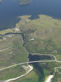 Oblique aerial view looking along the River Morar across the bridges, taken from the WSW.