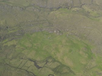 General oblique aerial view of the remains of the township, buildings and field system at Glendrian, taken from the SW.