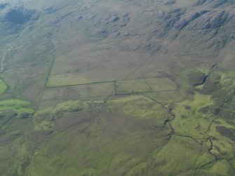 General oblique aerial view of the relict field grid-pattern boundaries, taken from the ESE.
