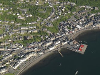 General oblique aerial view of Oban centred on the pier, taken from the NW.
