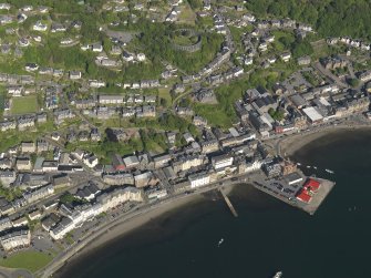 General oblique aerial view of Oban centred on the pier, taken from the WNW.