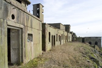 View from NW of row of buildings on W side of the island.