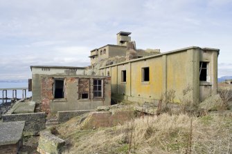 View from SSE looking back to No.1 Gun Emplacement and Battery Observation Tower with stores buildings in the foreground.