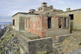 View from SSE showing S engine house and store building in foreground.