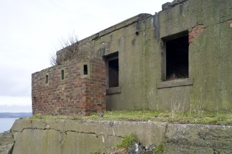 View from SSW showing brick built blockhouse/pillbox at N end of pier.