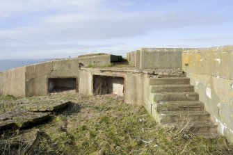 Detail of access steps and ready-use ammunition locker at base of re-used gun emplacement.