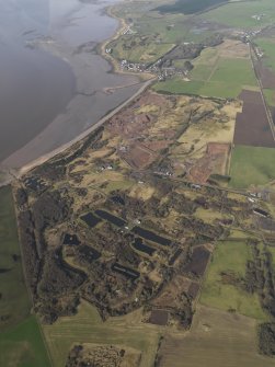 General oblique aerial view centred the remains of the Ordnance Factory, taken from the ENE.