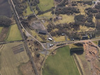 Oblique aerial view centred on part of the remains of the Ordnance Factory, taken from the WNW.