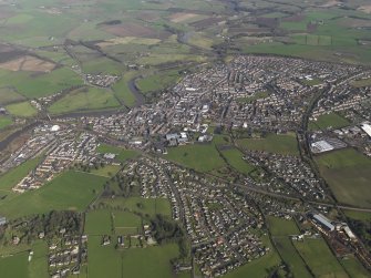 General oblique aerial view centred on the town, taken from the S.