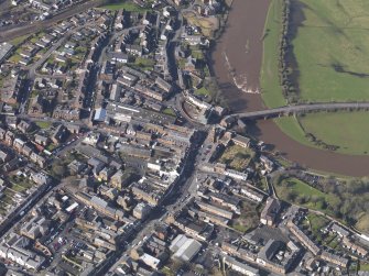 Oblique aerial view centred on the High Street, taken from the NE.
