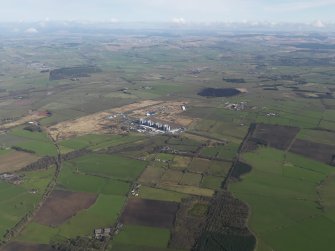 General oblique aerial view centred on the Nuclear power station with the airfield adjacent, taken from the S.