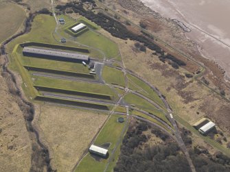 Oblique aerial view centred on the railway terminal in the explosives works, taken from the NW.