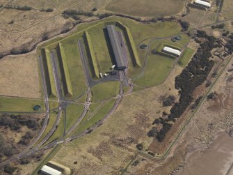 Oblique aerial view centred on the railway terminal in the explosives works, taken from the SW.