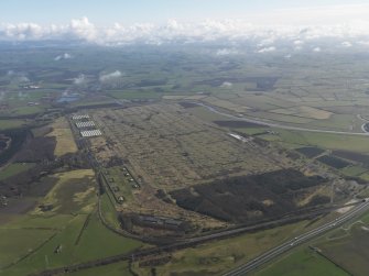 General oblique aerial view centred on the explosives stores, taken from the SW.