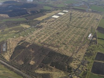 Oblique aerial view centred on the explosives stores, taken from the SW.