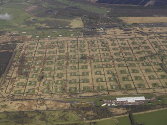 Oblique aerial view centred on the explosives stores, taken from the SE.