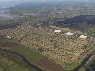 Oblique aerial view centred on the explosives stores, taken from the ESE.