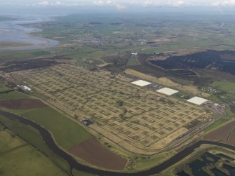 Oblique aerial view centred on the explosives stores, taken from the ESE.