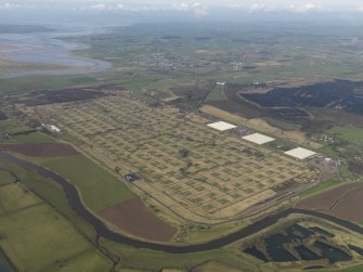 Oblique aerial view centred on the explosives stores, taken from the ESE.