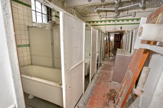 Interior. View looking along the cubicle row within the ground floor, female bath salon.