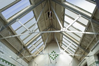 Interior. View looking up into the roof structure of the male bath salon, at 1st floor level of the bath house.