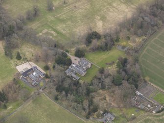 Oblique aerial view centred on the country house, taken from the NW.