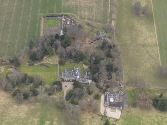 Oblique aerial view centred on the country house, taken from the NNE.