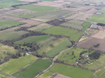 General oblique aerial view centred on two country houses, taken from the NE.