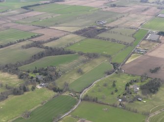 General oblique aerial view centred on two country houses, taken from the NE.