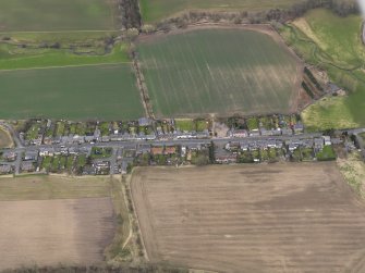Oblique aerial view centred on the village, taken from the N.