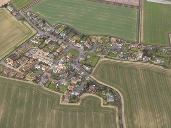 Oblique aerial view centred on the village, taken from the SSE.