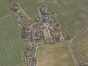 Oblique aerial view centred on the village, taken from the W.
