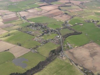 General oblique aerial view centred on the village, taken from the SE.