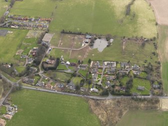 Oblique aerial view centred on the village, taken from the N.