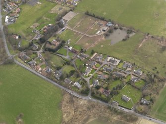 Oblique aerial view centred on the village, taken from the NW.