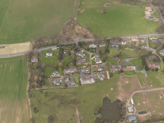 Oblique aerial view centred on the village, taken from the S.