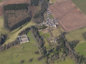 Oblique aerial view centred on the stable block with Buxley adjacent, taken from the S.