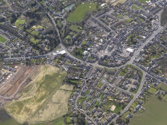 General oblique aerial view centred on the town, taken from the NE.