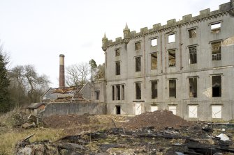 W range with chimney and W end of central block, view from SE