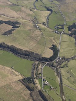 Oblique aerial view centred on the remains of the railway and the area of the demolished railway viaduct, taken from the SW.