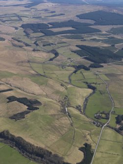 General oblique aerial view centred on the remains of the railway, taken from the SW.