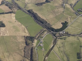 Oblique aerial view centred on the remains of the railway and the area of the demolished railway viaduct, taken from the SSW.