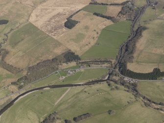 Oblique aerial view centred on the remains of the railway and the area of the demolished railway viaduct, taken from the S.